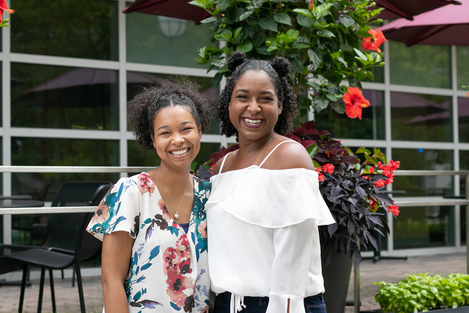 two women smiling for a picture